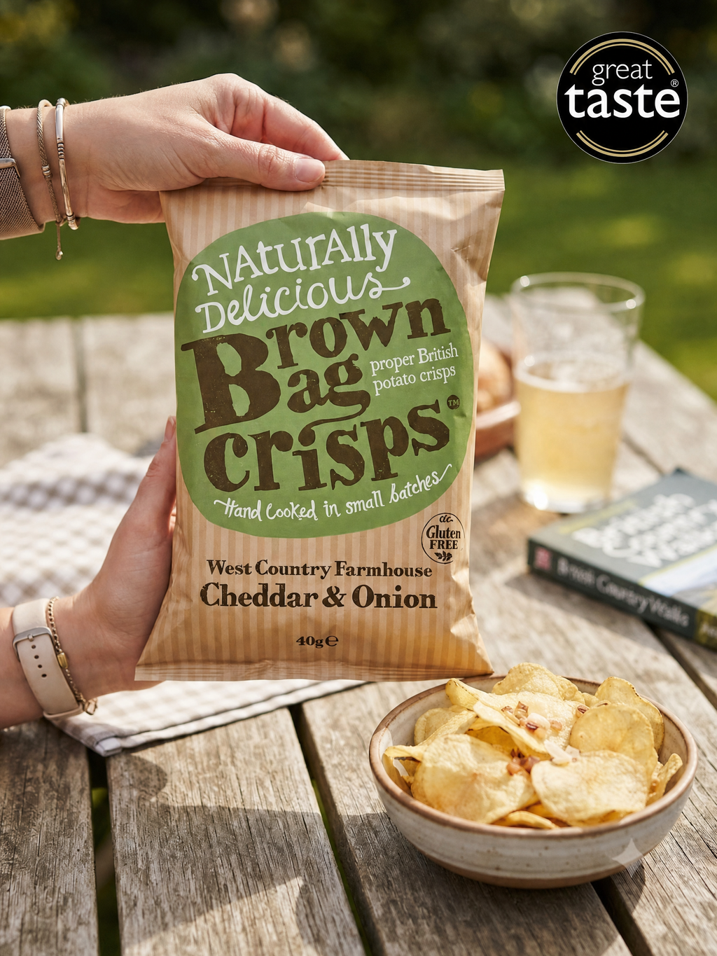 Brown Bag hand-cooked crisps, Cheddar & Onion flavor, 40g multipack, showcasing crispy snack bags with vibrant branding and flavor details.