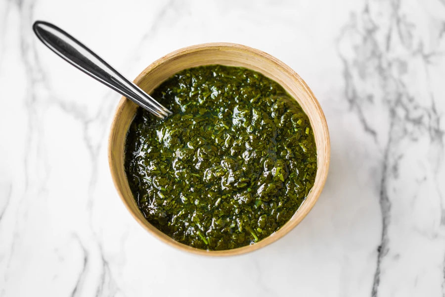 Colman's Garden Mint Sauce 2.25L bottle, a classic British condiment with fresh mint leaves in a clear plastic bottle.