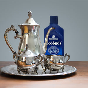 Goddard's Silver Polish Cloth for jewelry and silverware care, soft cloth with silver cleaning solution visible on surface.
