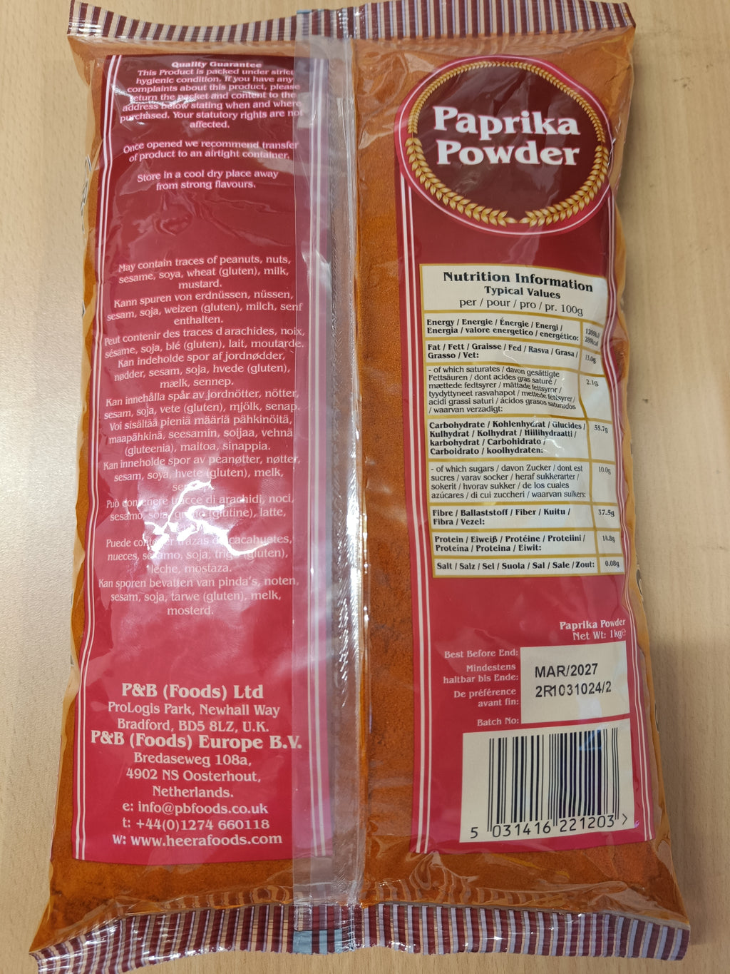 Heera Paprika Powder in 1kg and 5kg packs, premium ground paprika spice for cooking and catering, shown in a spice jar.