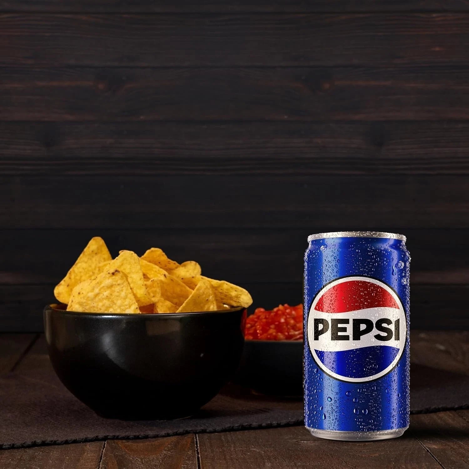 Case of 24 Pepsi Regular Cola 330ml cans, fizzy soft drinks with classic branding and red and blue design on the cans.