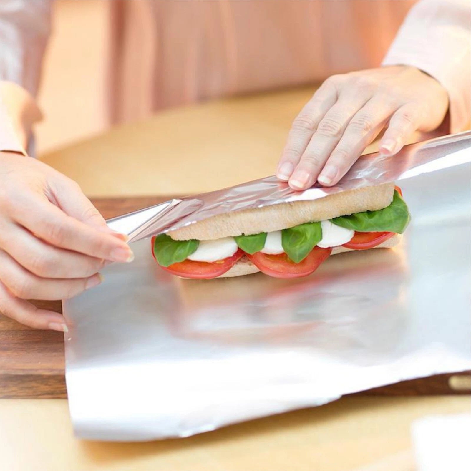 Reign Goods heavy duty aluminium kitchen foil roll, 75m, available in 300mm and 450mm widths, ideal for food packaging and wrapping.