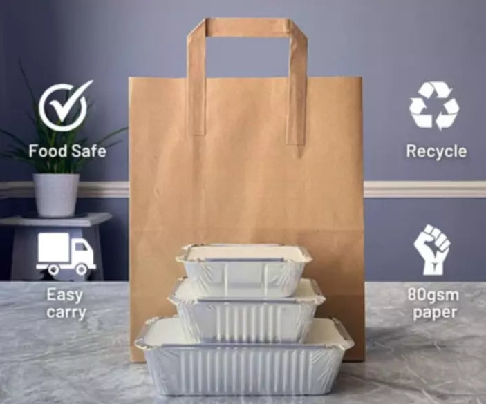 Large brown kraft paper bags with handles from Reign Goods, recyclable takeaway carrier bags for eco-friendly packaging.