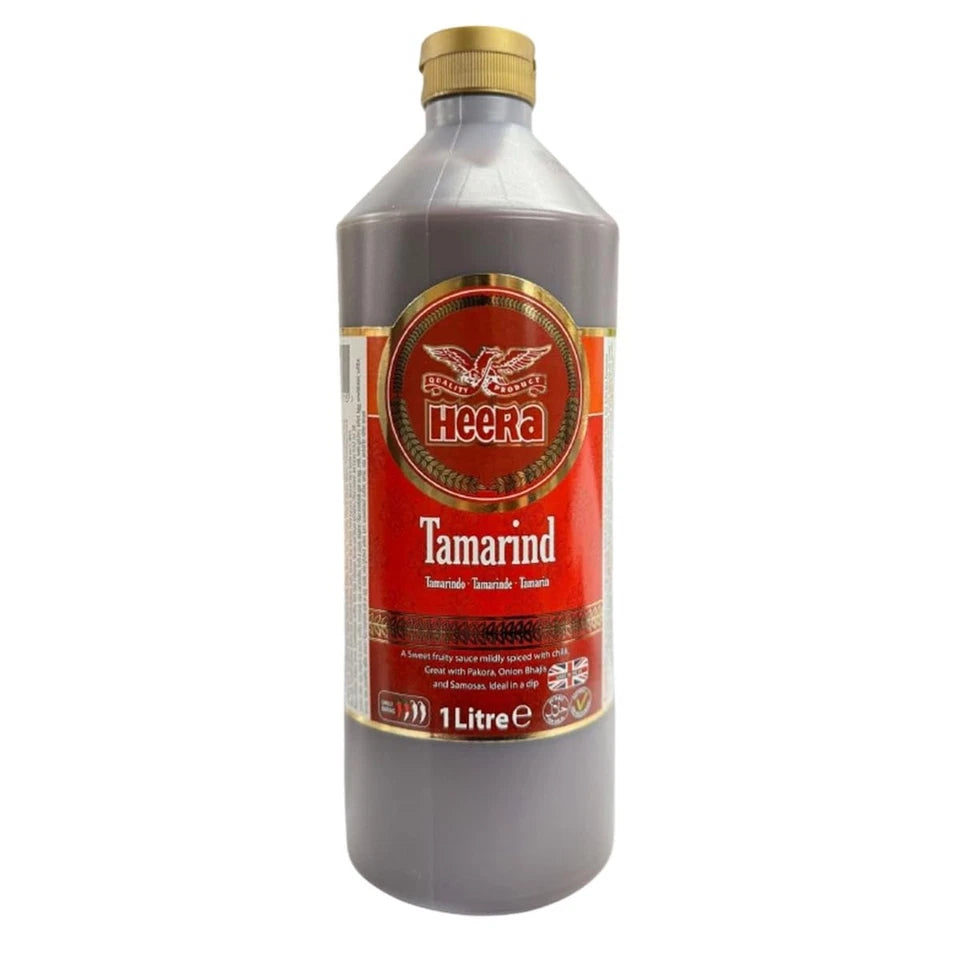Reign Goods Heera Tamarind Sauce 1L in a bottle, authentic Indian tamarind dipping and cooking sauce for flavorful dishes.