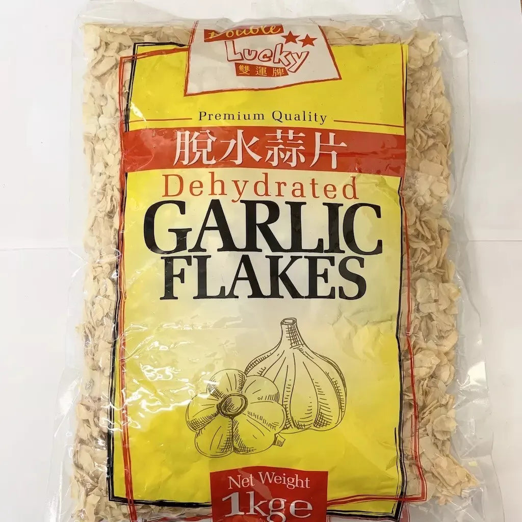 Reign Goods premium dehydrated garlic flakes in a clear jar, aromatic dried garlic for cooking and seasoning in bulk pantry.