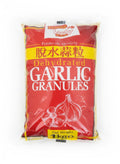 Reign Goods premium dried garlic granules in a clear jar, showing light yellow dehydrated garlic spice for seasoning and cooking.