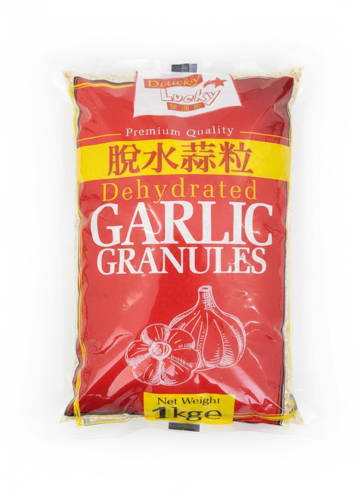 Reign Goods premium dried garlic granules in a clear jar, showing light yellow dehydrated garlic spice for seasoning and cooking.