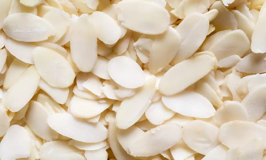 Premium Supreme almond flakes in a 1kg bag, natural sliced almonds for baking, cooking, and topping, displayed in a clear container.